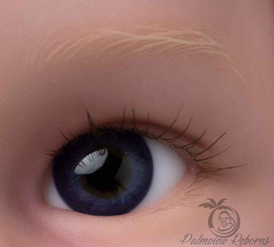 Close up of a Reborn doll eye rooted by Palmview Reborns