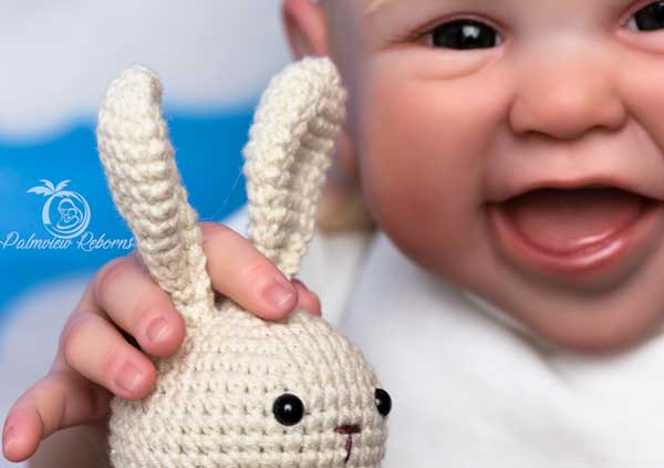 Reborn Jupiter by Melody Hess holding a toy bunny